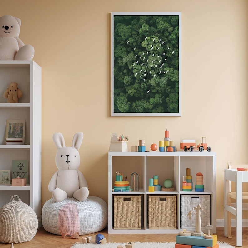 A cozy children's room with a large stuffed rabbit, a bookshelf, and a toy train set. The room has a warm, inviting atmosphere with a framed picture of a forest scene on the wall.