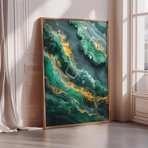 May include: A framed abstract art print featuring a swirling pattern of emerald green and gold. The artwork has a marbled effect with flowing lines and textures. The frame is a thin, gold color, and the artwork is leaning against a white wall.