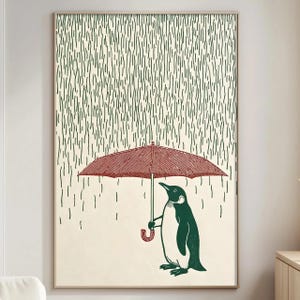 a penguin standing under an umbrella, with rain falling around it.