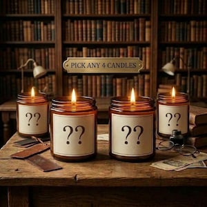 May include: Four amber glass jar candles with lit wicks, each featuring a cream-colored label with a black question mark. A gold-toned plaque above the candles reads PICK ANY 4 CANDLES. The candles are arranged on a wooden surface.