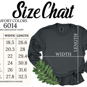 K&ouml;nnte beinhalten: Gr&ouml;&szlig;entabelle f&uuml;r ein Unisex-Langarmshirt. Die Tabelle zeigt die Breite und L&auml;nge in Zoll f&uuml;r die Gr&ouml;&szlig;en S, M, L, XL, 2XL und 3XL. Das Shirt ist in dunkelgrau dargestellt.