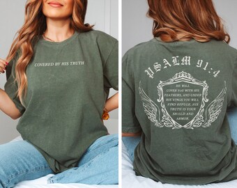 May include: A green t-shirt with the text "COVERED BY HIS TRUTH" on the front and "PSALM 91:4" and a verse from the Bible on the back.