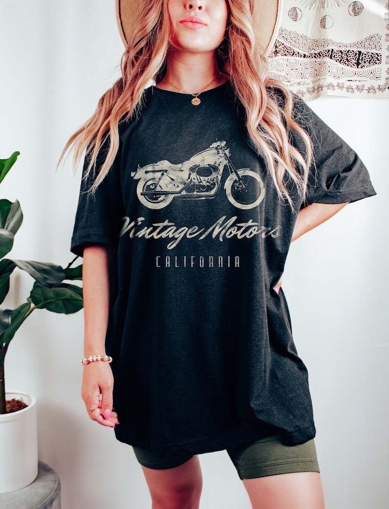 May include: Black oversized t-shirt with a vintage motorcycle graphic and the text "Vintage Motors California".