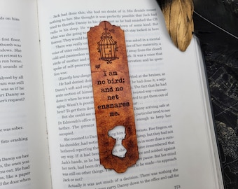 May include: A brown leather bookmark with a birdcage design and the text "I am no bird; and no net ensnares me."
