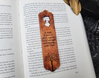 May include: A brown leather bookmark with a tree design and the text "I wish I were a girl again, half savage and hardy, and free."