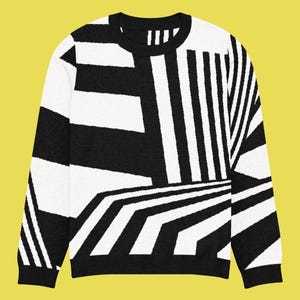 K&ouml;nnte beinhalten: Schwarz-wei&szlig;er Pullover mit geometrischem Muster. Das Design zeigt Streifen und eckige Formen, die einen auff&auml;lligen visuellen Effekt erzeugen. Der Pullover hat einen Rundhalsausschnitt und lange &Auml;rmel. Ein stilvolles Kleidungsst&uuml;ck.