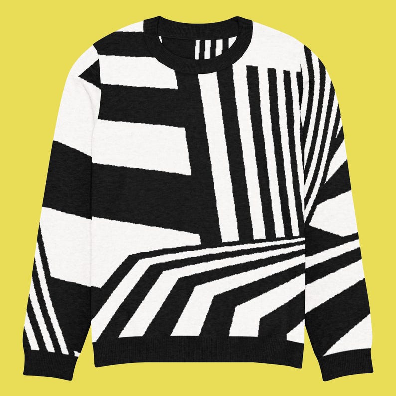 K&ouml;nnte beinhalten: Schwarz-wei&szlig;er Pullover mit geometrischem Muster. Das Design zeigt Streifen und eckige Formen, die einen auff&auml;lligen visuellen Effekt erzeugen. Der Pullover hat einen Rundhalsausschnitt und lange &Auml;rmel. Ein stilvolles Kleidungsst&uuml;ck.