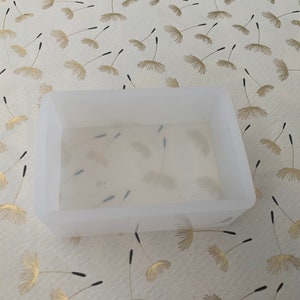 May include: A white silicone mold for resin casting, with a rectangular shape. The mold is empty and ready to be filled with resin.