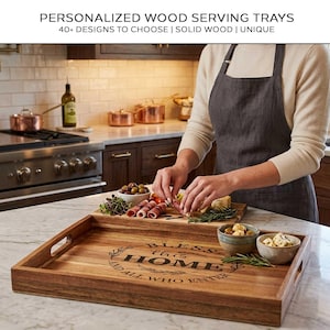 May include: A rectangular wooden serving tray with handles, featuring the text "BLESS this HOME and ALL WHO ENTER." The tray is filled with food items, including olives, cheese, and rolled meats. The image also shows a person preparing food in a kitchen.