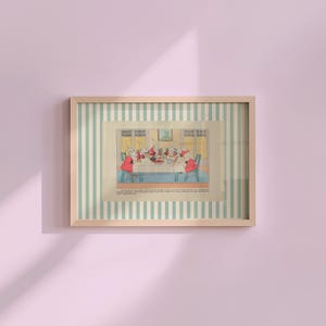 May include: A framed vintage illustration depicts rabbits gathered around a table, dressed in red coats. The artwork is set against a striped background of light blue and white, encased in a wooden frame. The image is mounted on a pink wall.