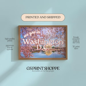 May include: A framed print featuring a scenic view of Washington D.C. with cherry blossoms. The print includes the text "see you in Washington D.C." and is from GS Print Shoppe. The print is available in XL sizes.