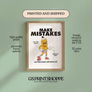 May include: A framed print featuring the words "MAKE MISTAKES" and a cartoon pencil character. The print also includes the text "every day there is a lesson to learn" and "use that eraser and move on!" The frame is a light brown colour.