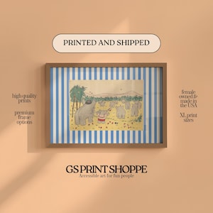 May include: Framed art print featuring a whimsical illustration of elephants in a field, set against a blue and white striped background. The print is in a brown frame. The text "PRINTED AND SHIPPED" is at the top.