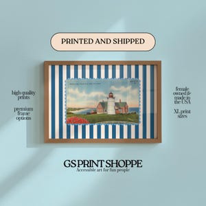 May include: Framed print featuring a vintage postcard image of a lighthouse with red and white buildings, set against a blue and white striped background. The frame is brown. Text includes "PRINTED AND SHIPPED" and "GS PRINT SHOPPE Accessible art for fun people."