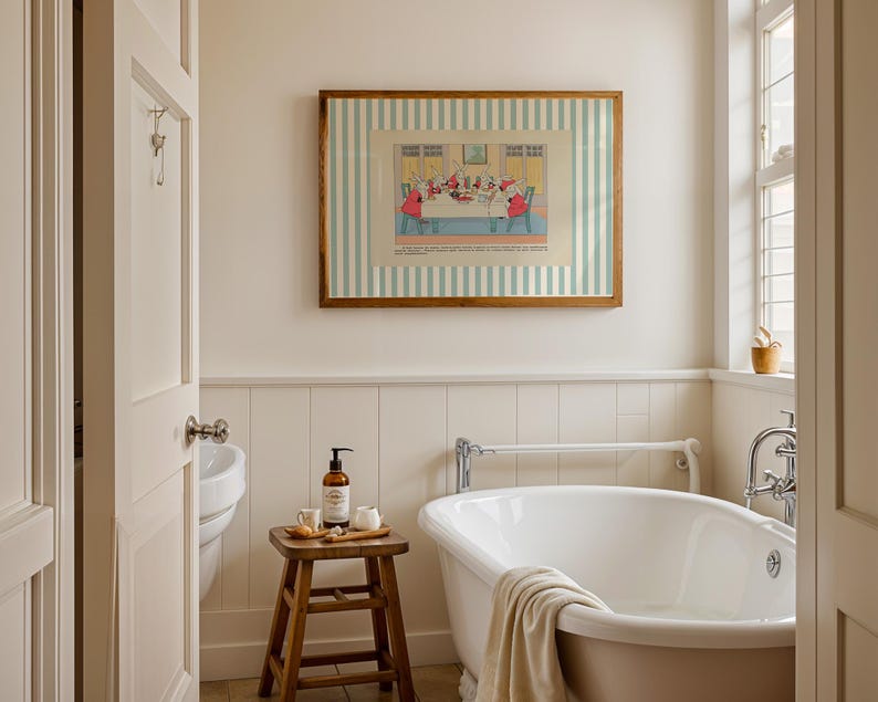 May include: A bathroom scene featuring a white clawfoot bathtub, a wooden stool with toiletries, and a framed print with a striped background. The walls are painted in a neutral color, and a window provides natural light. The overall aesthetic is clean and classic.
