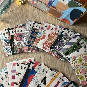 50 unique mini laminated envelopes | 50 envelope challenge | savings challenge | cash envelopes