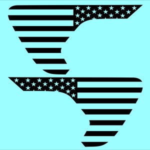 May include: Two black and white American flag designs on a light blue background. The designs are stylized, with the stars and stripes arranged in a unique, abstract shape. The image is a graphic design.