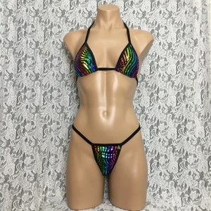 May include: A black bikini set with a rainbow sequined pattern. The top is a triangle style with adjustable straps. The bottom is a cheeky style with a low rise.