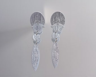 Boucles d'oreilles élégantes brillantes acrylique vinyle alu brossé argent
