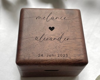 Ring box for wedding rings made of walnut wood with engraving for the wedding