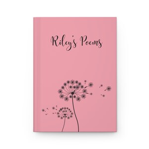May include: A pink hardcover journal featuring the black text Riley's Poems printed in a cursive font at the top. Below the text, two black dandelion illustrations are depicted with seeds blowing toward the right side of the cover.