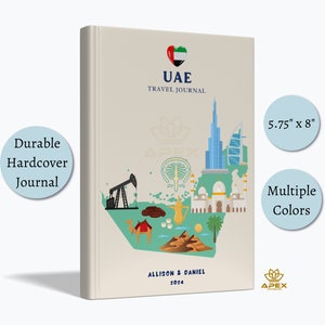 May include: A beige hardcover travel journal measuring 5.75 inches by 8 inches. The cover features a heart-shaped UAE flag, the text UAE TRAVEL JOURNAL, and illustrations of landmarks, a camel, and oil equipment. It includes the names ALLISON & DANIEL 2024.