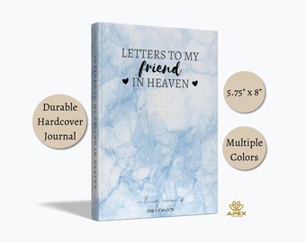 May include: A durable hardback journal with a light blue marble pattern. The cover features the text "LETTERS TO MY FRIEND IN HEAVEN" with two black hearts, and "in loving memory of EMILY JOHNSON" at the bottom. The journal measures 14.6 cm by 20.3 cm.