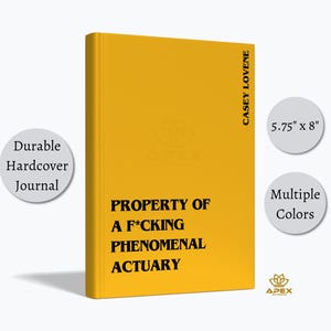 May include: A yellow hardcover journal measuring 5.75 inches by 8 inches. The front cover features the black text "PROPERTY OF A F*CKING PHENOMENAL ACTUARY" and the name "CASEY LOVENE" printed vertically along the right edge of the cover.