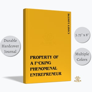 May include: A mustard yellow hardback journal featuring black text on the front cover reading PROPERTY OF A F*CKING PHENOMENAL ENTREPRENEUR and CASEY LOVENE on the side. The journal measures 14.6 cm by 20.3 cm and is a durable hardback item.