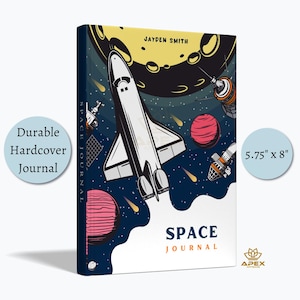 May include: A durable hardcover journal measuring 5.75 inches by 8 inches. The cover features a space-themed illustration with a white space shuttle, a yellow moon, red and pink planets, and satellites against a dark blue background. The text reads "JAYDEN SMITH" and "SPACE JOURNAL".