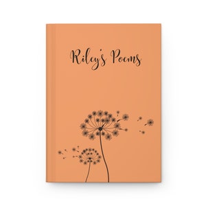 May include: A hardcover journal with a solid peach-colored cover. The front features the black text "Riley's Poems" in a cursive script above a black graphic illustration of two dandelion flowers with seeds blowing in the wind to the right.