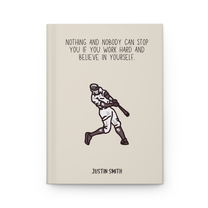 May include: A beige notebook with the text "NOTHING AND NOBODY CAN STOP YOU IF YOU WORK HARD AND BELIEVE IN YOURSELF." and a baseball player illustration. The name "JUSTIN SMITH" is printed at the bottom.