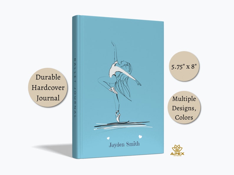 May include: A light blue hardcover journal measuring 5.75 inches by 8 inches. The cover features a black and white line drawing of a ballet dancer, the text "BALLET JOURNAL" on the spine, and the name "Jayden Smith" printed at the bottom.