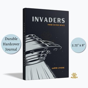 May include: A black hardcover journal measuring 5.75 inches by 8 inches. The cover features a white graphic illustration of a flying saucer emitting a beam of light, with the text INVADERS FROM OUTER SPACE and the author name AARON LOVENE.
