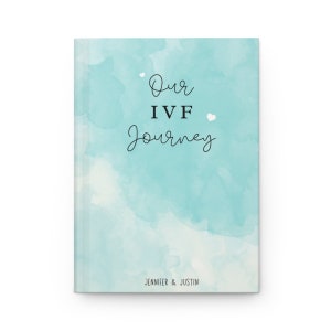 May include: A light blue watercolor journal cover with the text "Our IVF Journey" and the names "Jennifer & Justin" at the bottom.