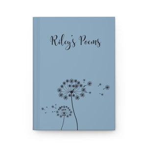 May include: A light blue hardcover journal featuring the black text "Riley's Poems" printed in a cursive font at the top. Below the text, there is a black graphic illustration of two dandelion seed heads with seeds blowing in the wind.