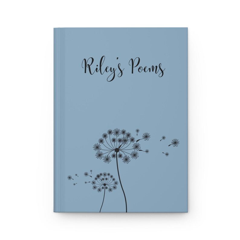 May include: A light blue hardcover journal featuring the black text "Riley's Poems" printed in a cursive font at the top. Below the text, there is a black graphic illustration of two dandelion seed heads with seeds blowing in the wind.