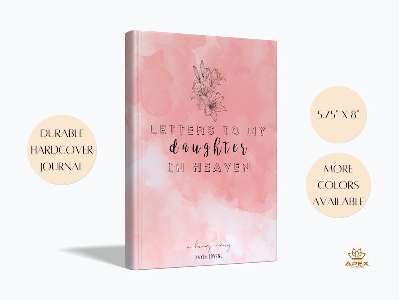 May include: A pink hardcover journal with a watercolor background and a black line drawing of lilies. The text on the cover reads "Letters to my daughter in heaven" and "in loving memory Kayla Lovene". The journal measures 5.75 inches by 8 inches.