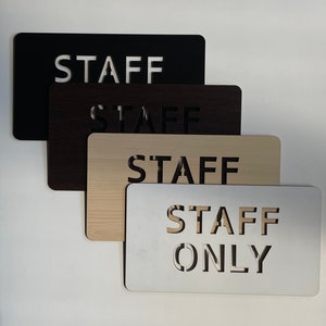 Wooden sign “Staff only”