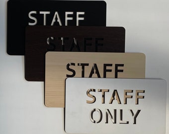 Wooden sign “Staff only”