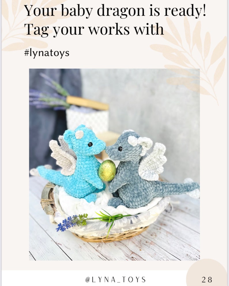 May include: Two crocheted baby dragons, one light blue and one gray, sit in a woven basket. The dragons have wings and are facing each other, holding a golden egg. Text on the image reads "Your baby dragon is ready!" and "#lynattoys".