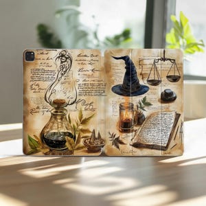 May include: A tablet case featuring a vintage-style illustration of a witch's apothecary. The design includes a potion bottle, a witch's hat, scales, a spell book, and other magical elements. The background has aged paper textures.