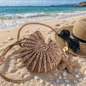 May include: A straw hat with a black band and sunglasses sit on a sandy beach alongside a woven handbag and a starfish. The beach bag has a braided strap and wooden beads. The scene suggests a relaxing summer day.