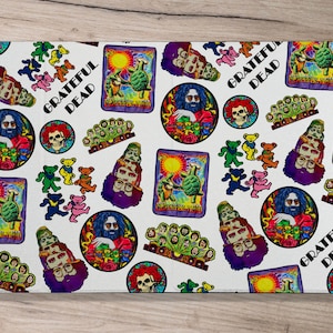 May include: White phone case with a colorful pattern featuring the Grateful Dead logo, band members, and psychedelic imagery.