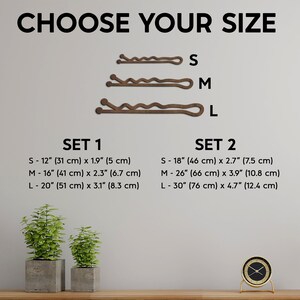 May include: The image displays three brown hair pins in different sizes, labeled S, M, and L. Text above reads "CHOOSE YOUR SIZE." Below, two sets of sizes are listed, with measurements in inches and centimeters. The image also includes two small potted plants and a gold clock.