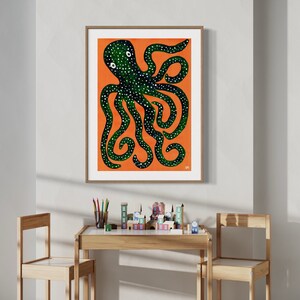 May include: A framed illustration of a green octopus with white spots on an orange background.