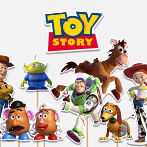 May include: A collection of Toy Story character cutouts, including Woody, Buzz Lightyear, Jessie, and others. The Toy Story logo is displayed at the top. The characters are on wooden sticks, ready for use as cake toppers or party decorations.