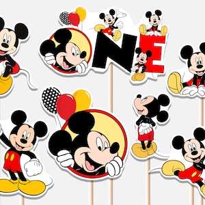 May include: A collection of Mickey Mouse-themed party decorations. The set includes various cutouts of Mickey Mouse in different poses, along with the word "ONE" in red and black. Balloons in red, yellow, and black polka dots are also included.