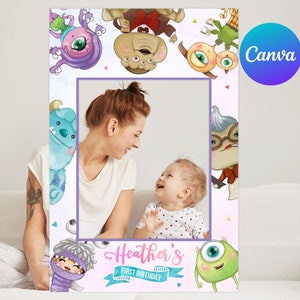 May include: A photo booth frame decorated with colourful cartoon monsters. The frame has a central aperture for a photograph and the text reads "Heather's First Birthday". The Canva logo is visible in the top right corner.