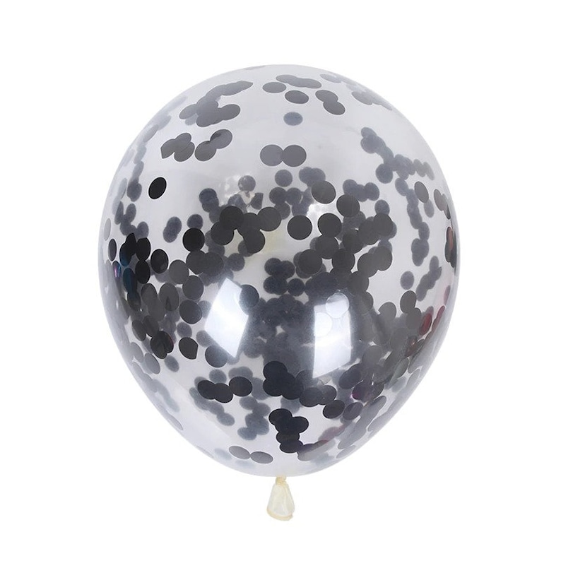 May include: A clear balloon filled with black confetti. The balloon is inflated and ready to be used for a party or celebration.
